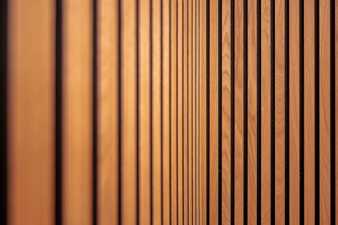 Close-up of vertical wood acoustic slats with dark gaps